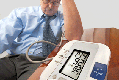 man looking at wife's portable heart monitor